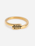 Gold ring with "MADE ALIVE" engraving