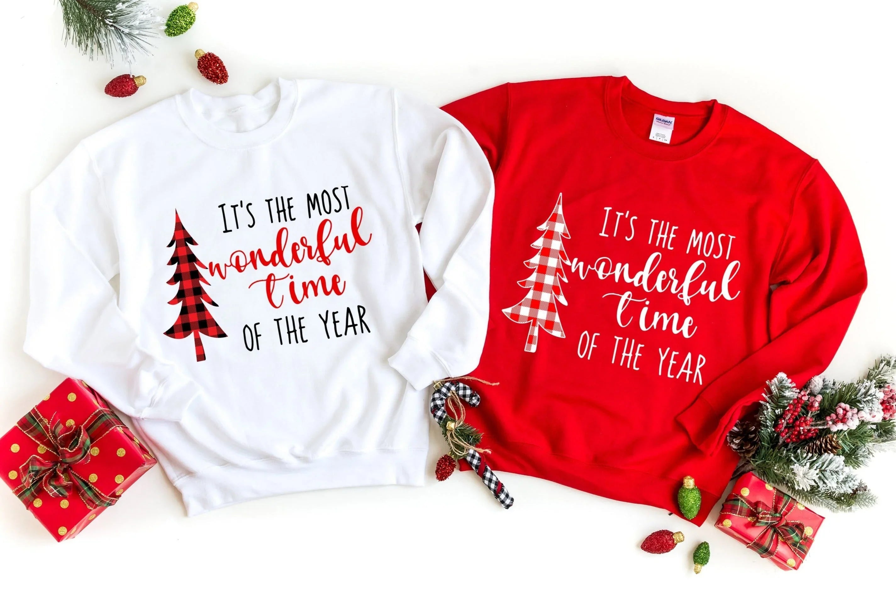 Red and white crewneck sweatshirts with holiday tree text graphic