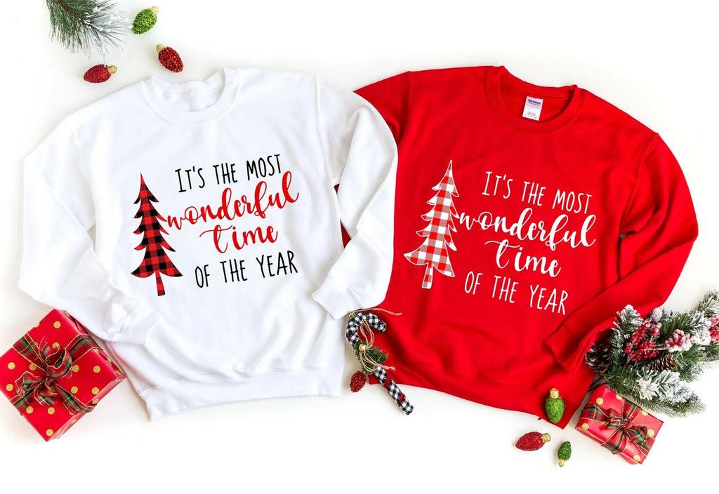 Sweatshirts set: white and red crewneck tops with Christmas tree and 'most wonderful time' prints
