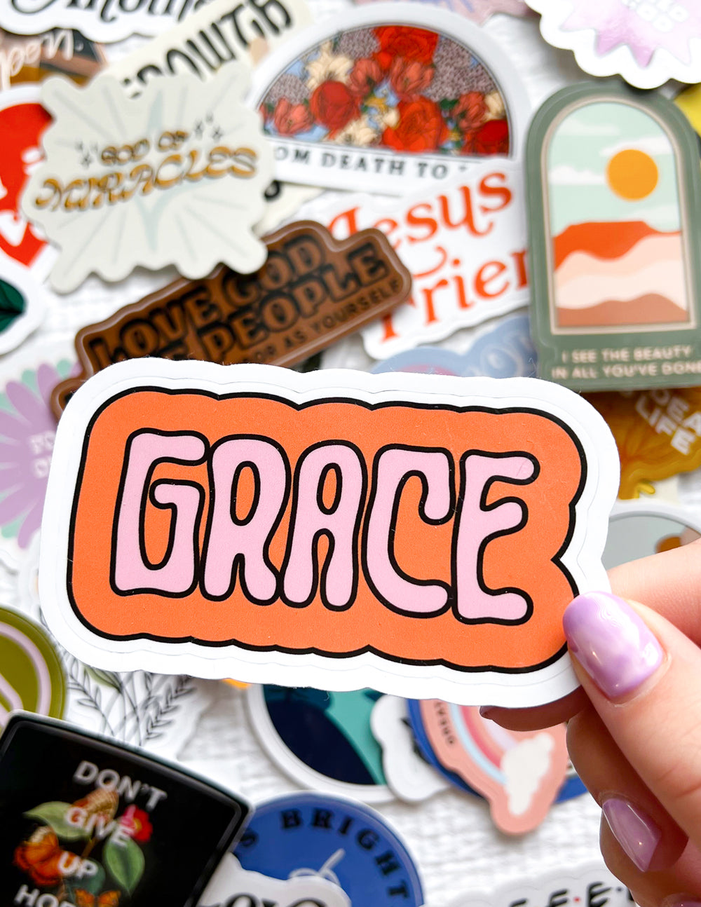 Grace sticker with bold orange outline, surrounded by faith-themed word and icon stickers