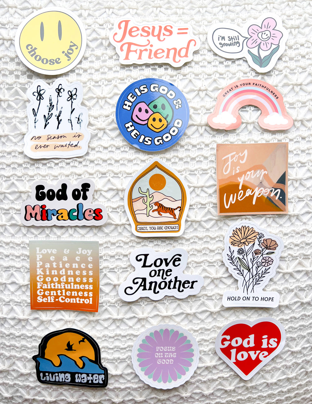 Assorted Christian vinyl stickers, including 'God of Miracles' and 'Love' typography