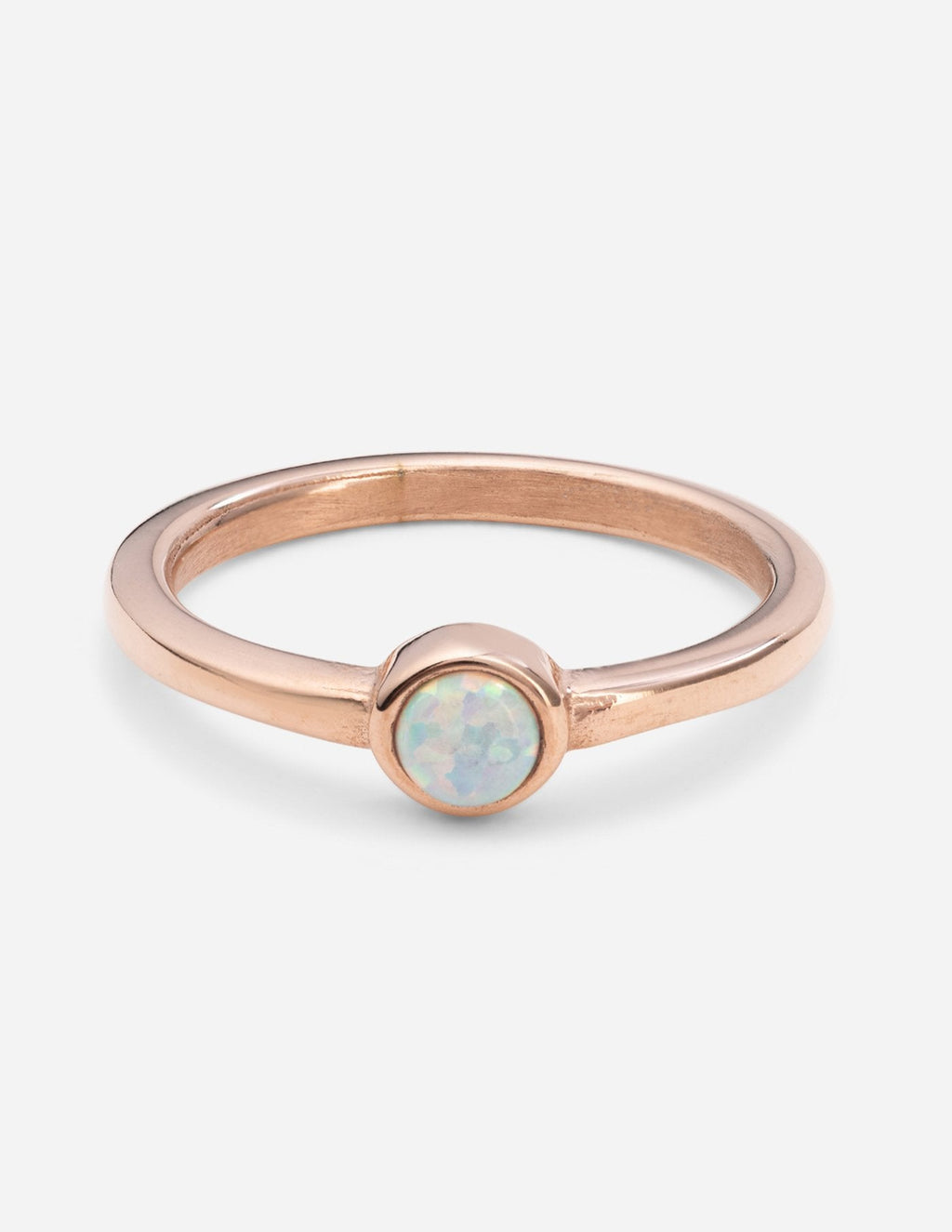 Rose gold pearl ring with round opal-like stone bezel