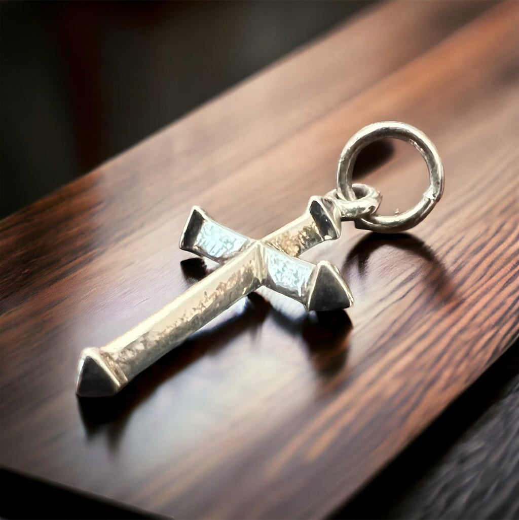Sterling silver cross pendant with round loop bail and small darkened edges