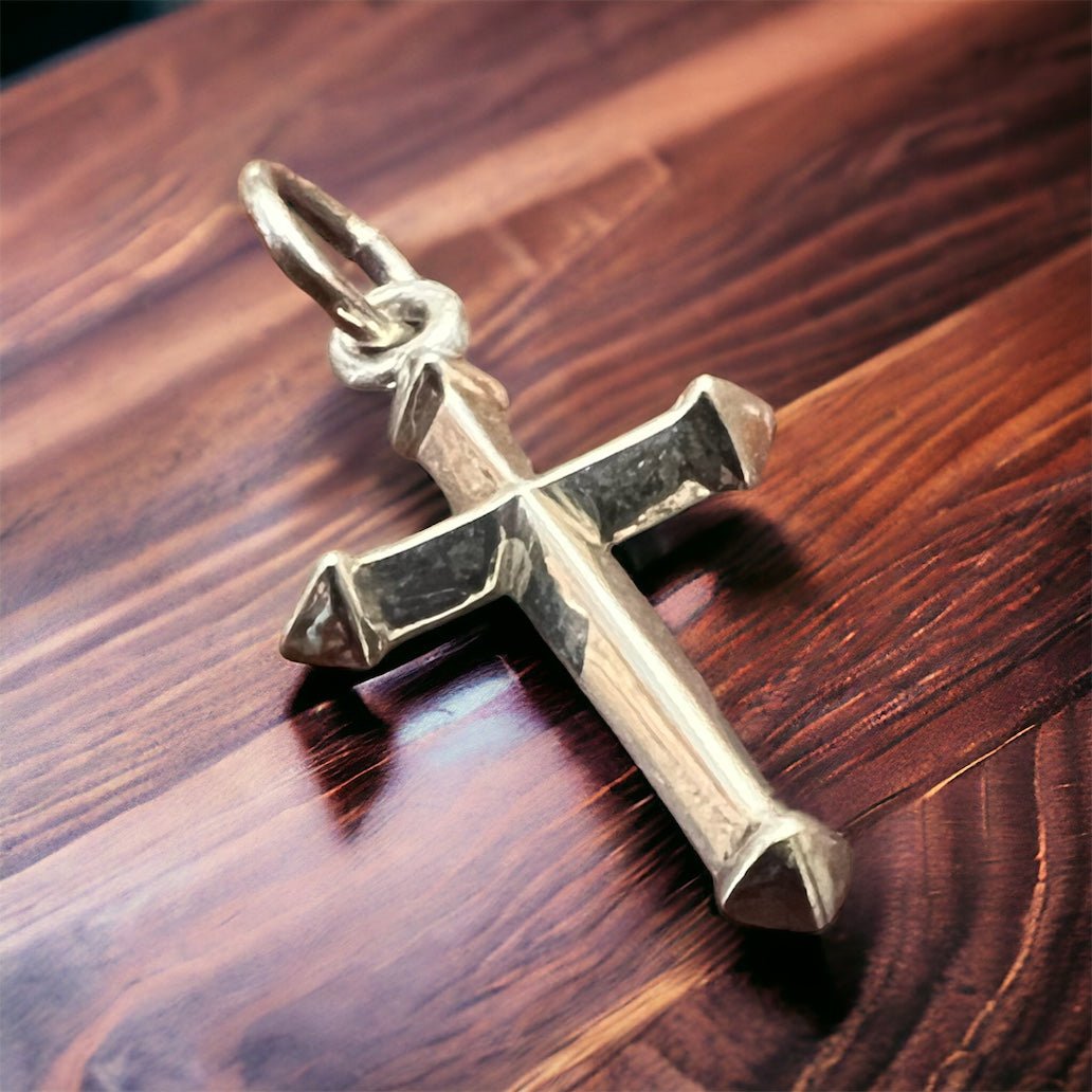 Sterling silver cross charm with loop bail, polished and beveled details