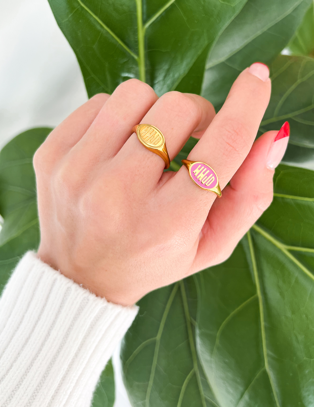 Pink enamel WWJD ring with gold-tone band and pink oval enamel face