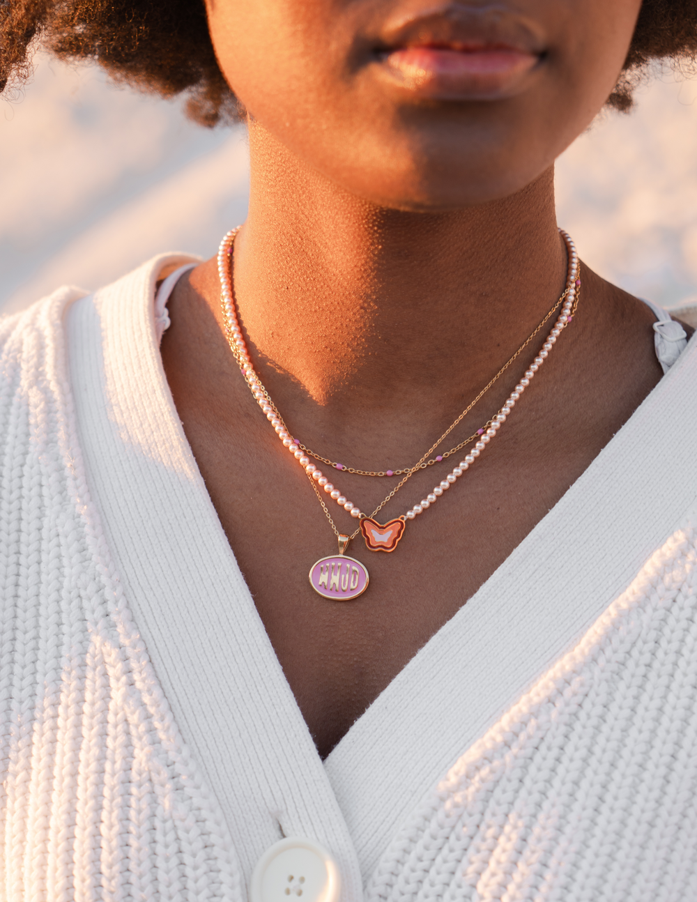 Gold-tone necklace set with pink WWJD round pendant and small heart charm