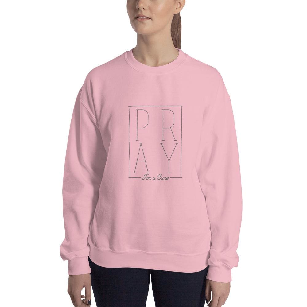 Light pink sweatshirt with centered PRAY graphic in square outline