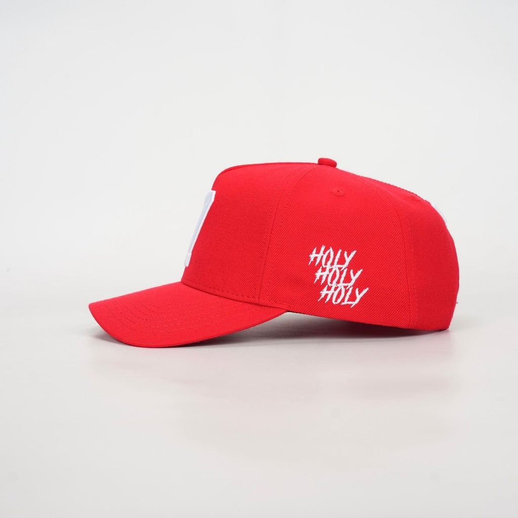 Red snapback cap with white script logo on side panel