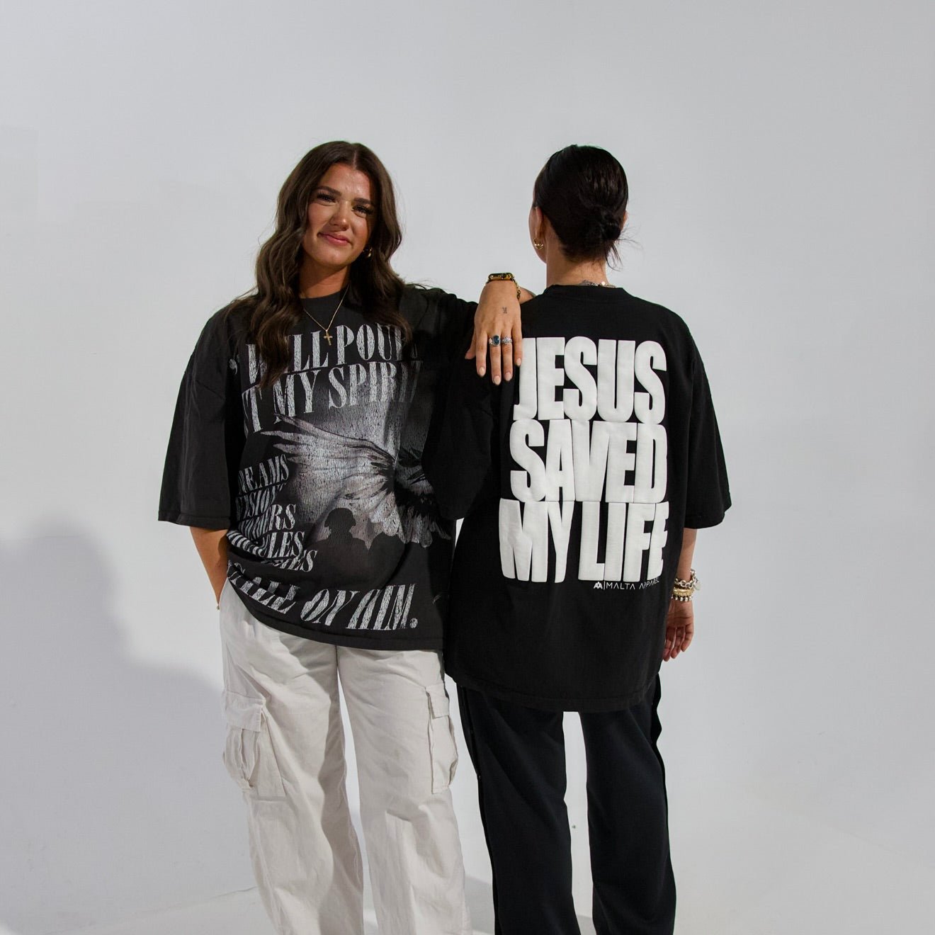 Black T-shirts with front and back JESUS SAVED MY LIFE puff print designs.