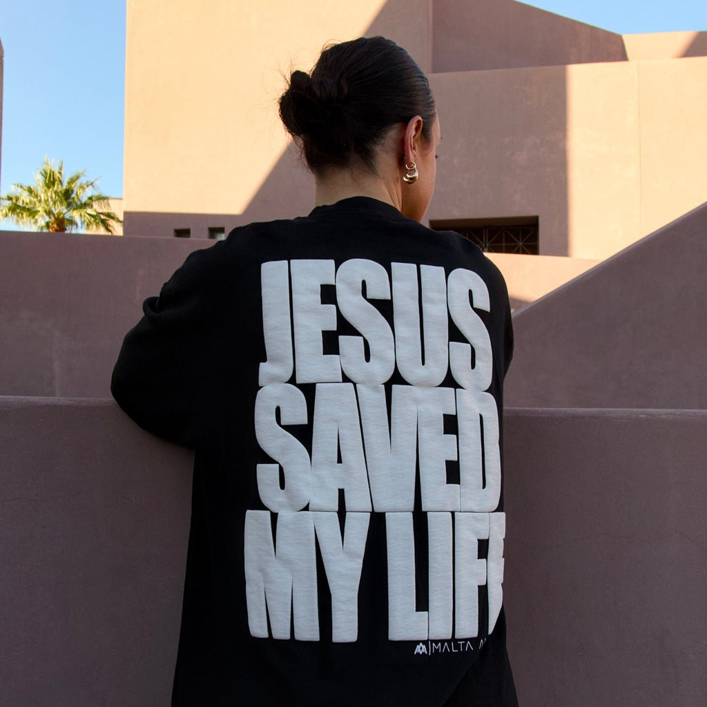 Black pullover hoodie with white puff-print back graphic letters