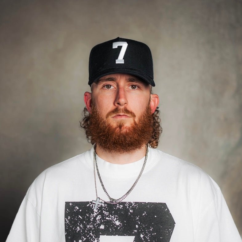 Black snapback cap with white "7" logo on front