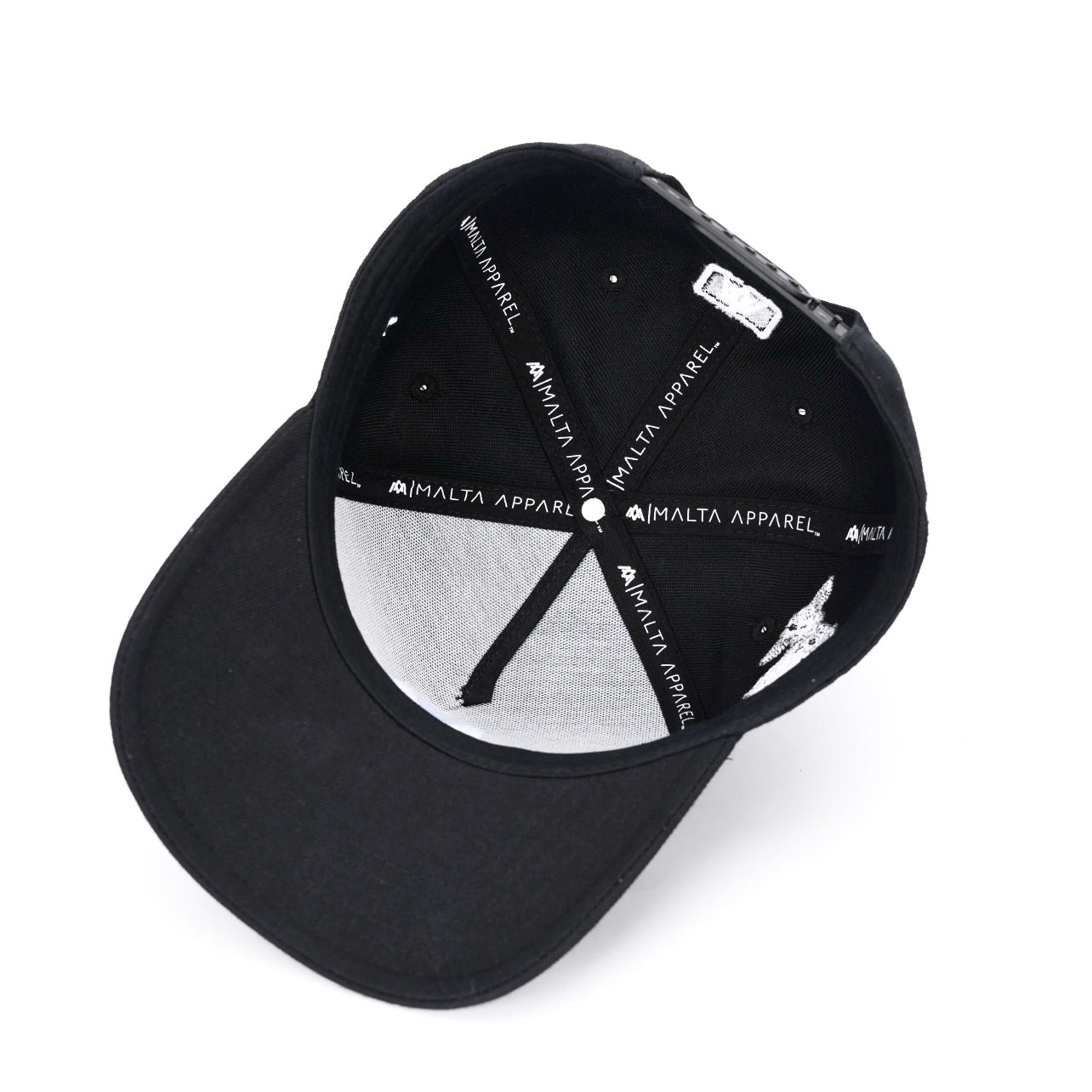 Black snapback cap interior with white-and-black panels and adjustable strap