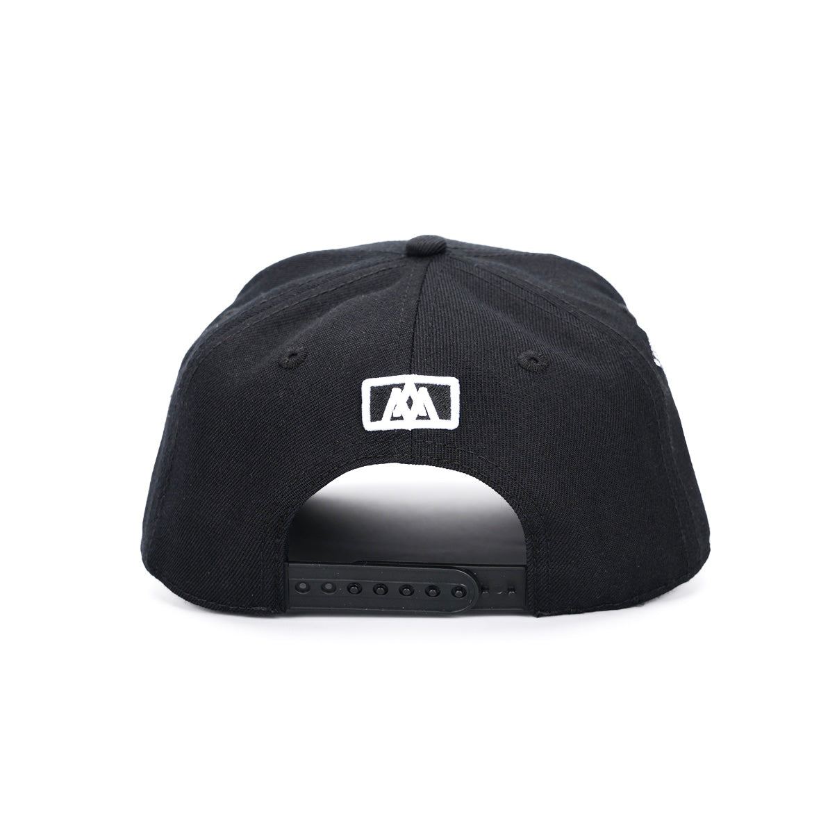 Black snapback cap with adjustable strap and small white logo patch on back