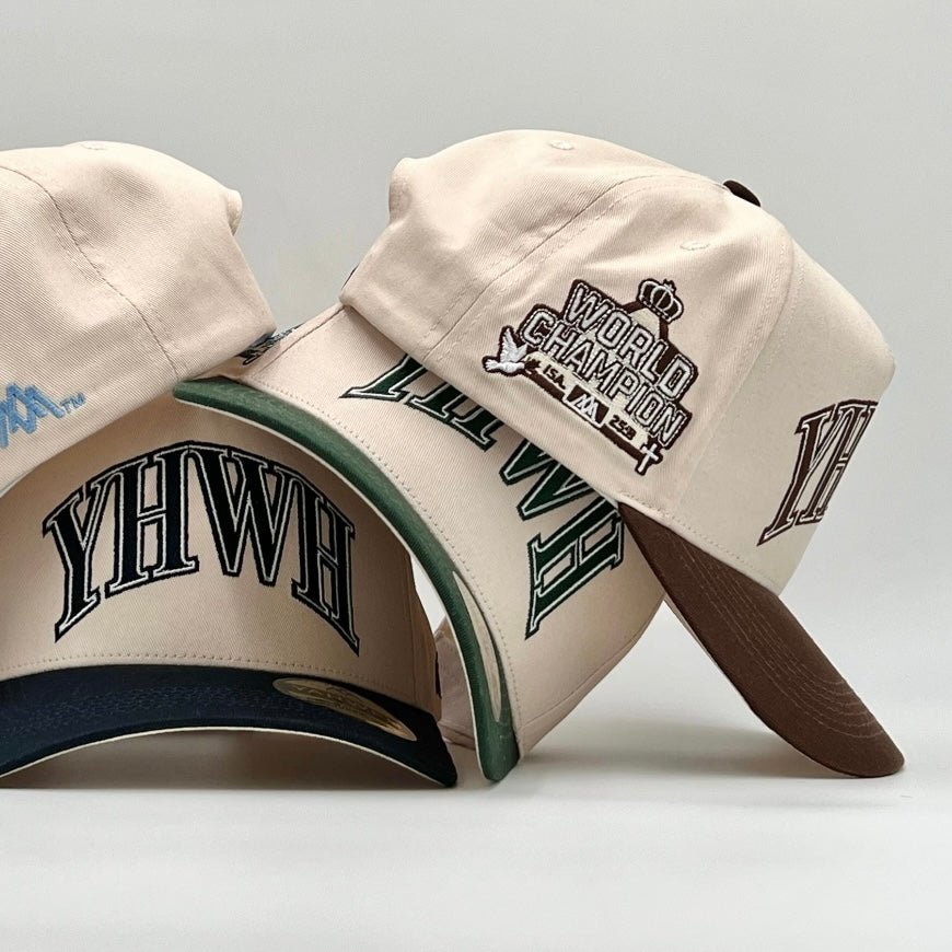 Cream and brown snapback cap with YHWH logo and World Champion side patch