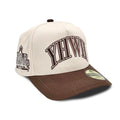 Cream and brown snapback cap with YHWH front logo and curved brim