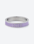 Lavender enamel ring with silver metal edges and the word LOVED across the band