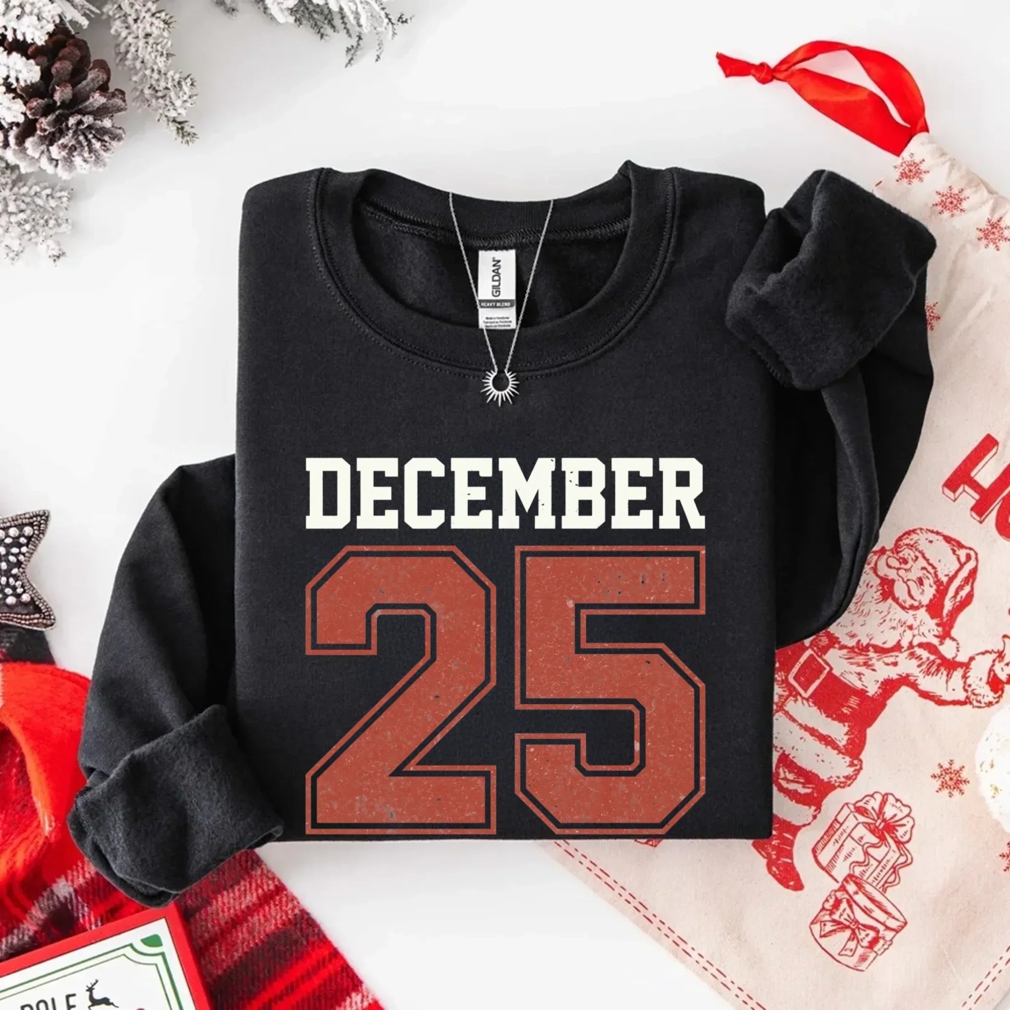 Black crewneck sweatshirt with retro 'DECEMBER 25' front print, long sleeves