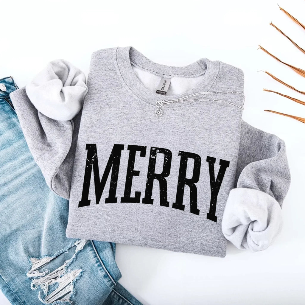 Women’s holiday sweatshirt in gray with “MERRY” front graphic and crewneck button placket