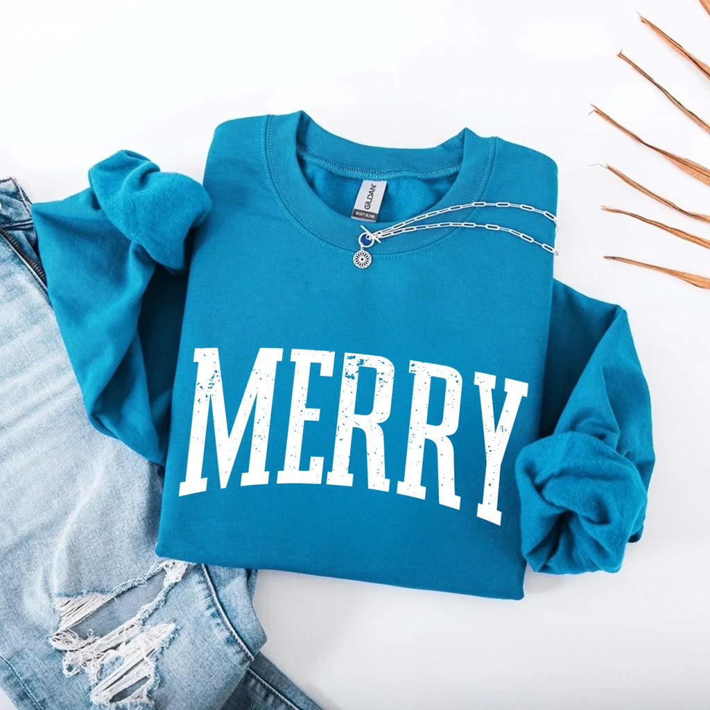 Women’s holiday sweatshirt in teal with “MERRY” front graphic and crewneck buttons