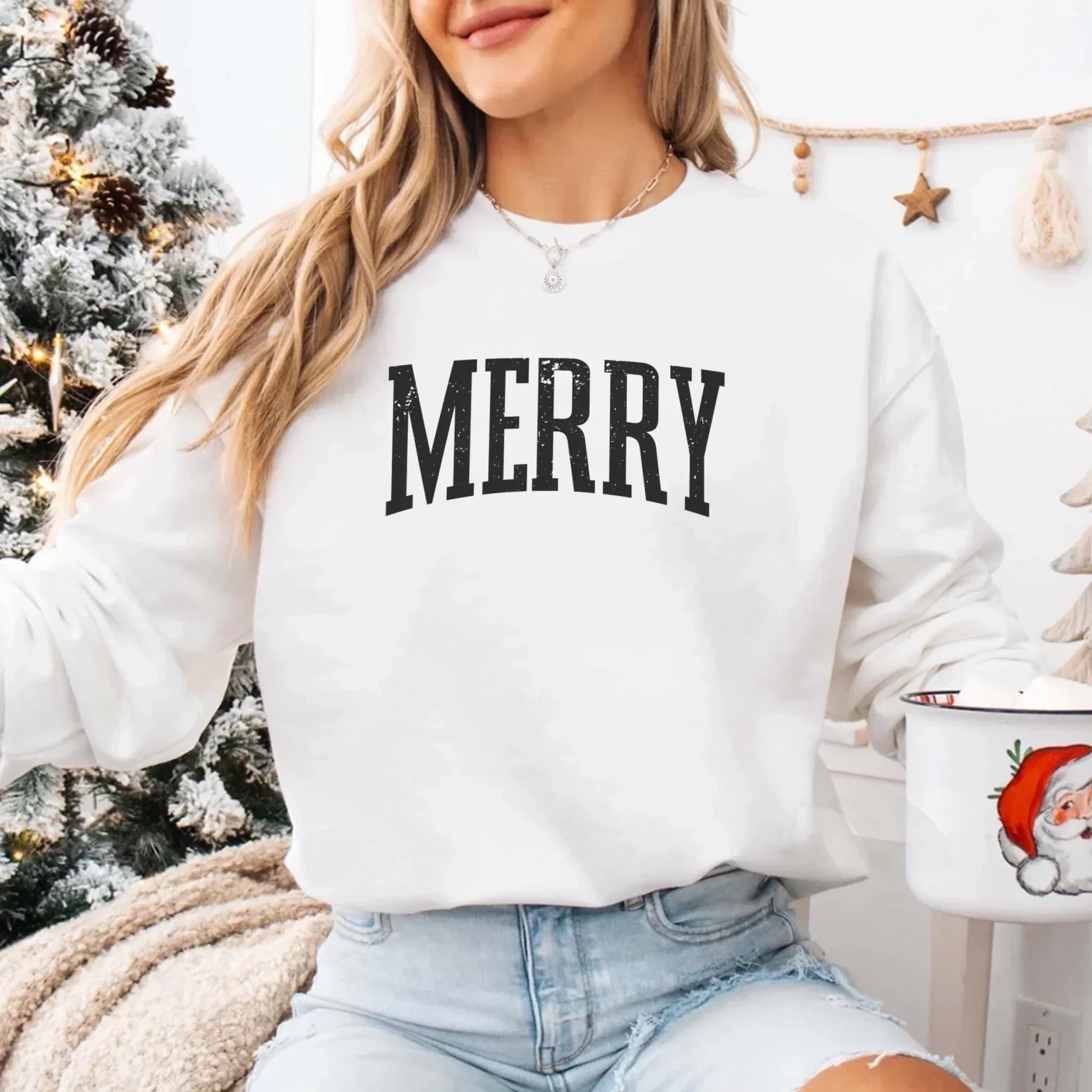 White crewneck sweatshirt with large black "MERRY" print
