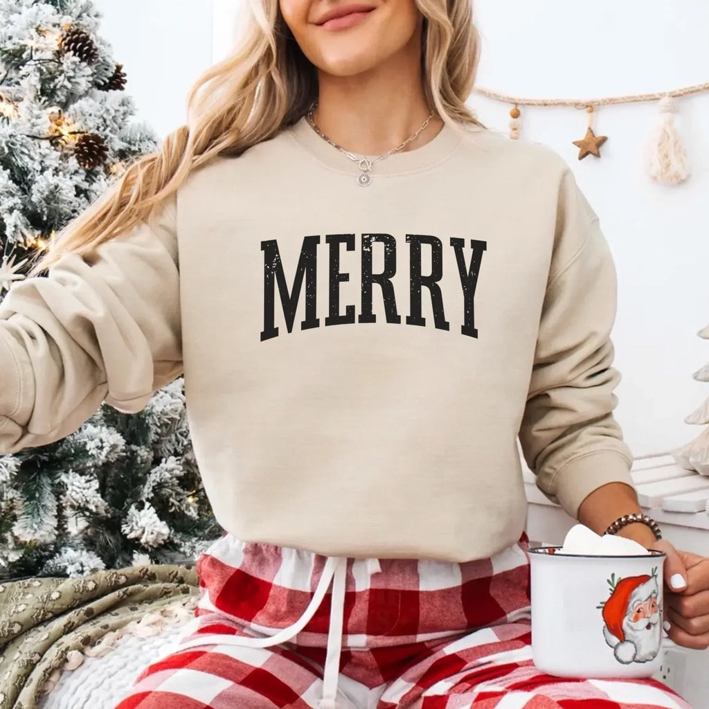 Women’s holiday sweatshirt in cream with “MERRY” front graphic and crewneck detail
