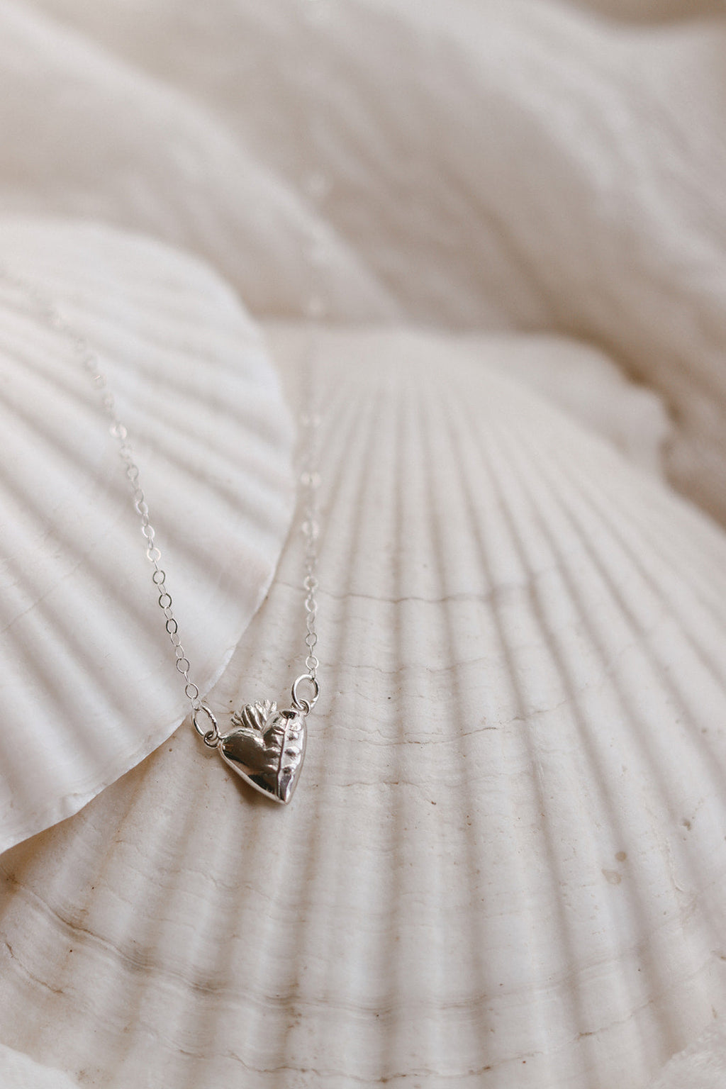 Sterling silver necklace with heart charm pendant and fine link chain
