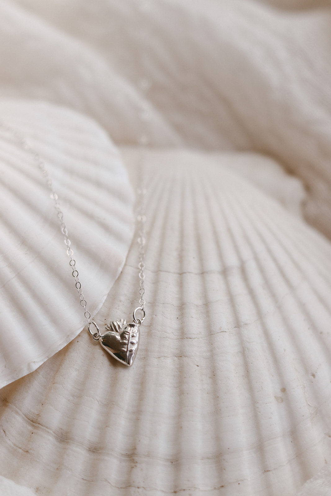 Sterling silver necklace with heart charm pendant and fine link chain