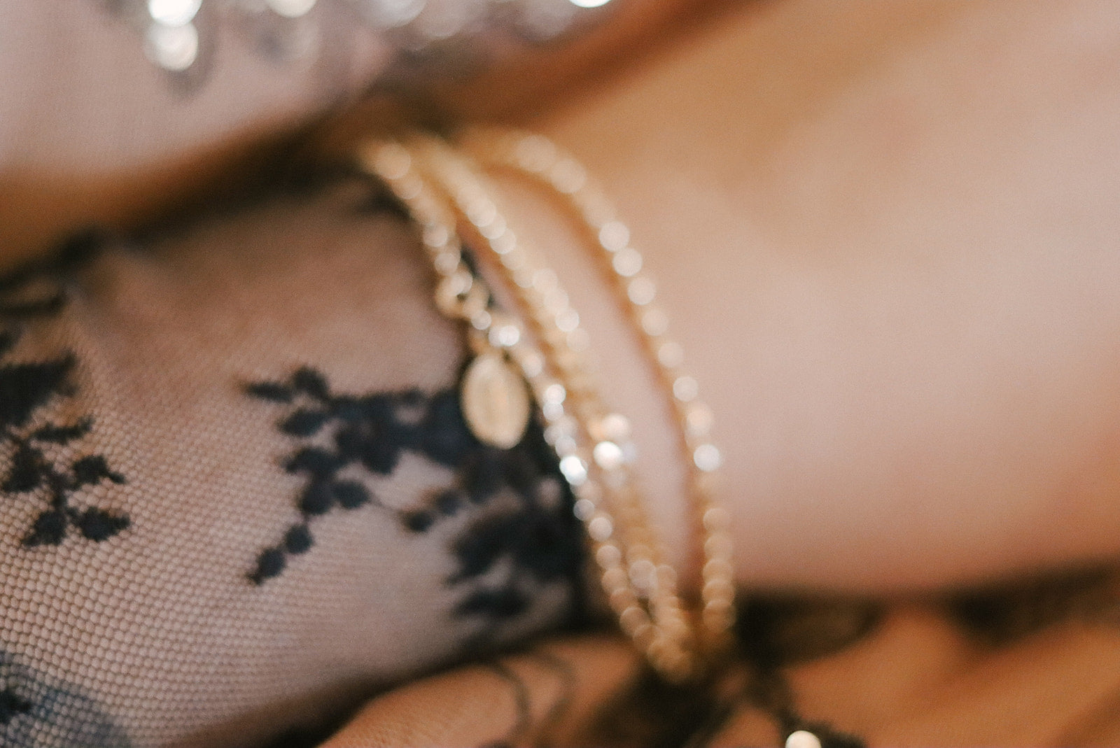 Gold-tone layered bracelet with pearl-bead strand and small chain