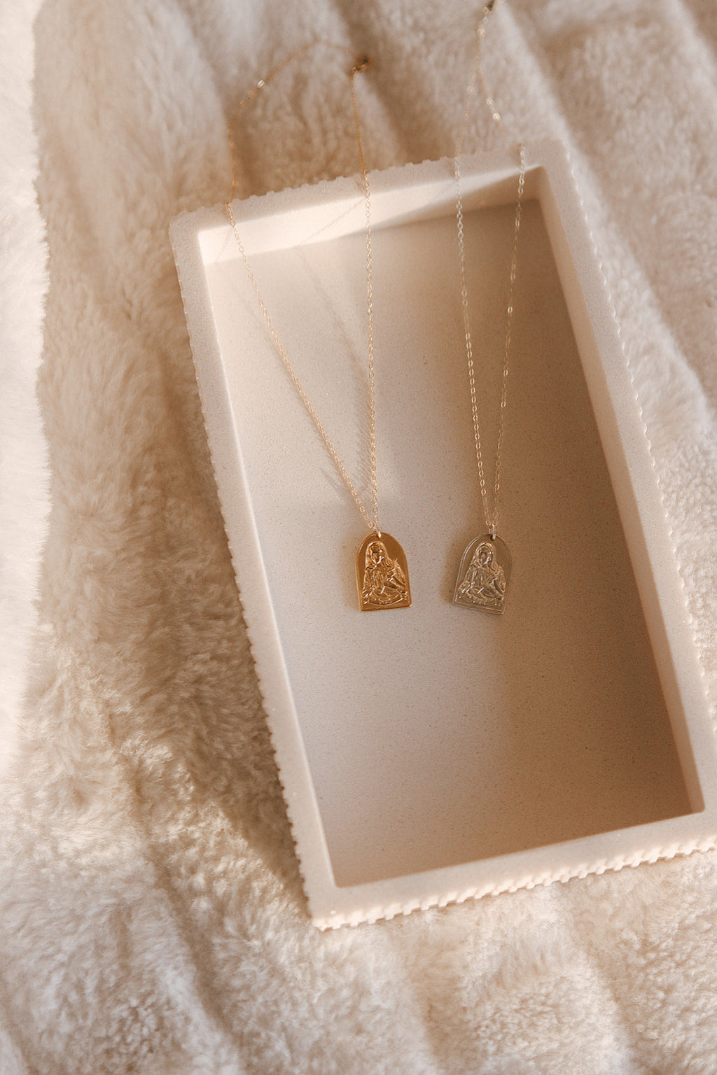 Gold-tone pendant necklace with two St. Catherine of Sweden charms on chain