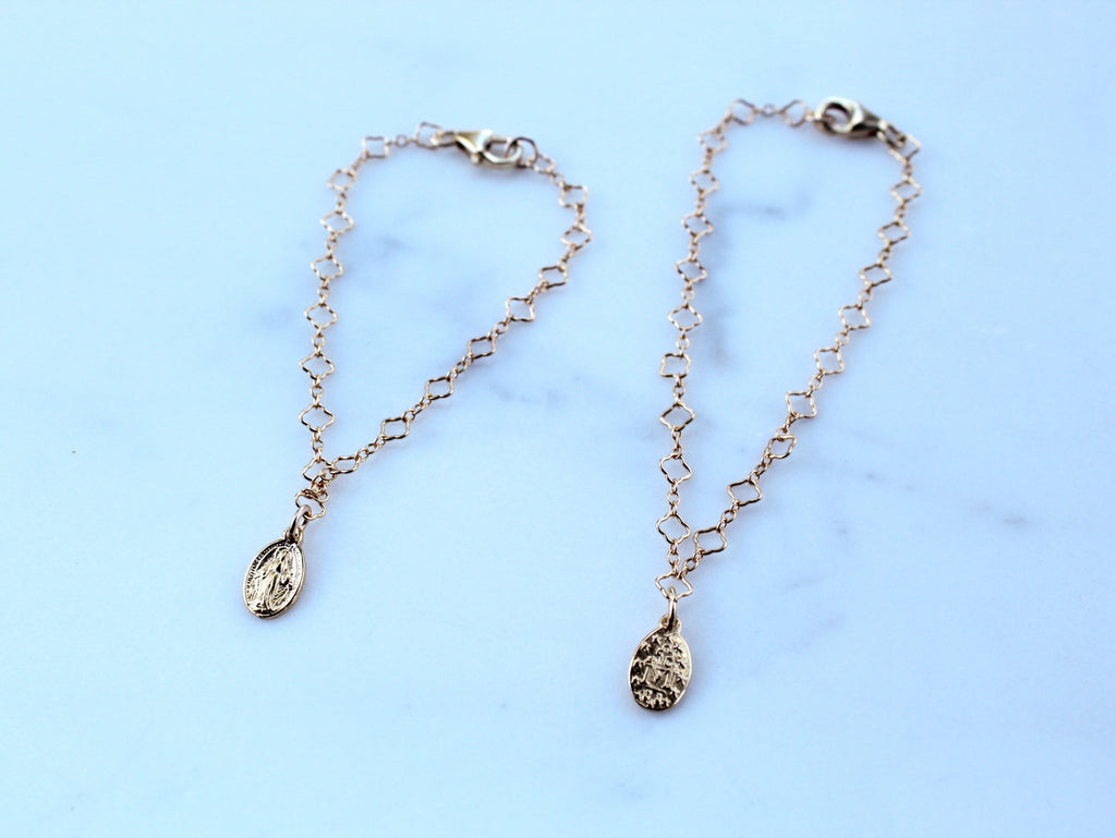 Silver-tone chain bracelet with small circular charm medallions