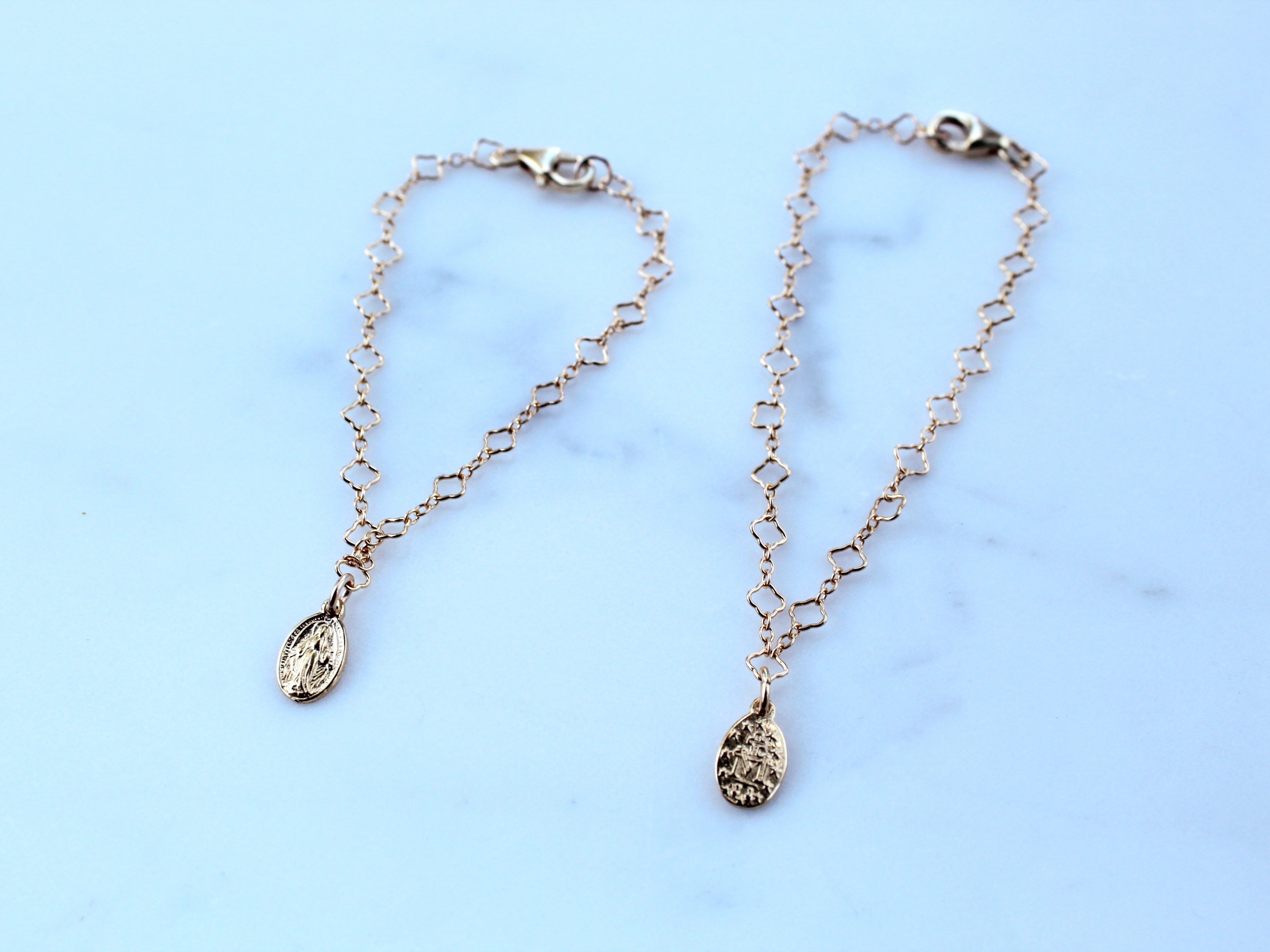 Silver-tone chain bracelet with small circular charm medallions