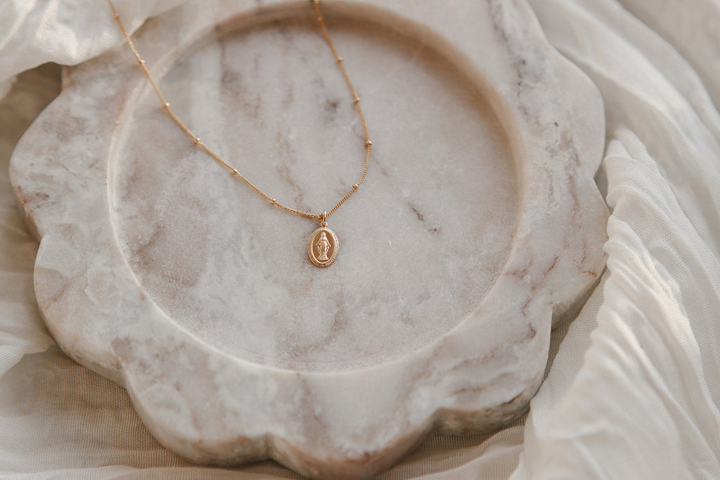 Gold-tone ball-chain necklace with round medal pendant