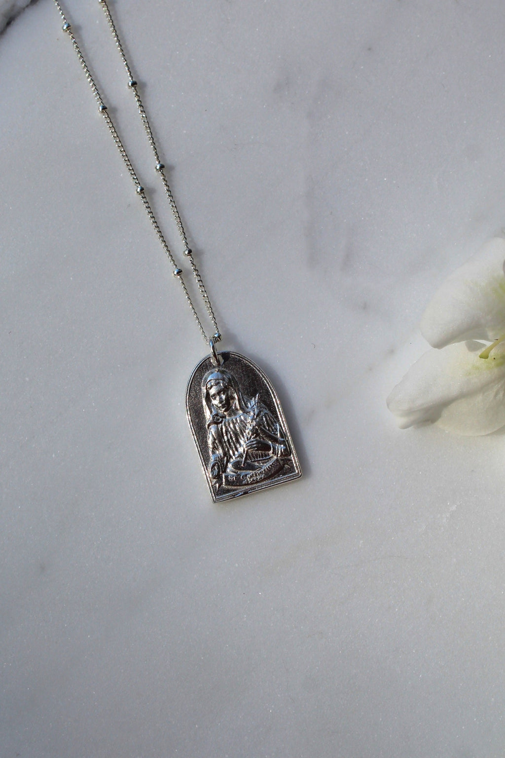 Sterling silver Saint Catherine pendant necklace with detailed arched saint charm on chain