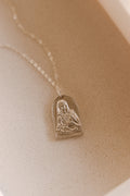 Sterling silver necklace with oval Saint figure pendant on a fine chain