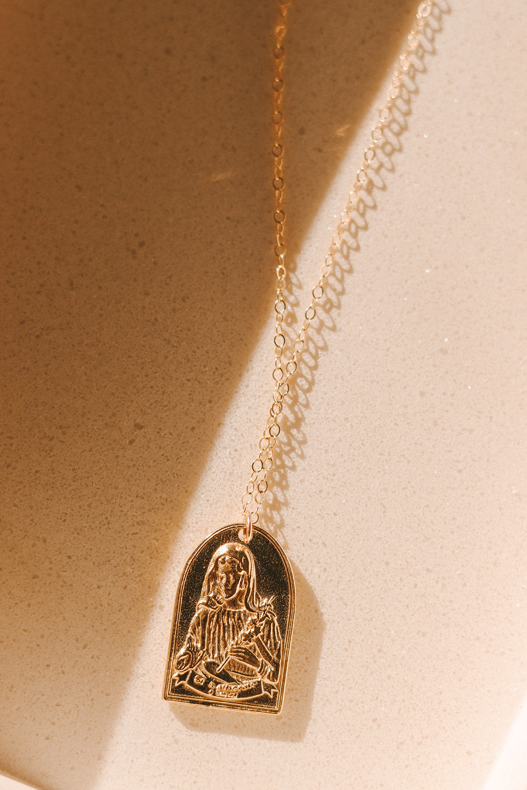 Gold St. Catherine of Sweden pendant necklace with engraved seated saint heart charm