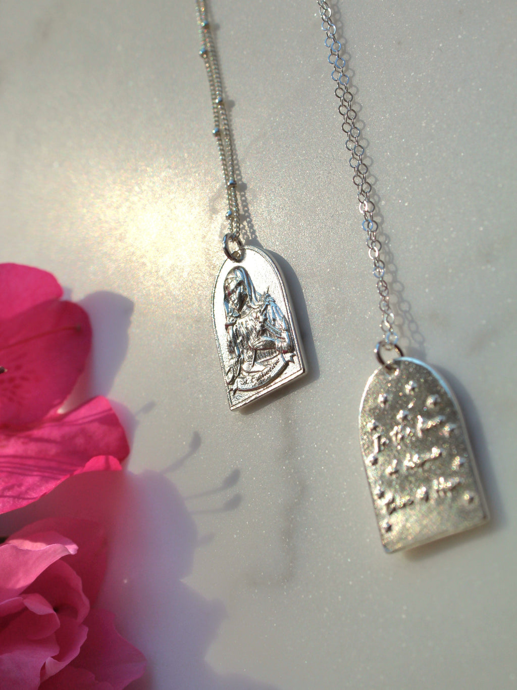 Sterling silver necklace with heart pendant, saint relief and chain