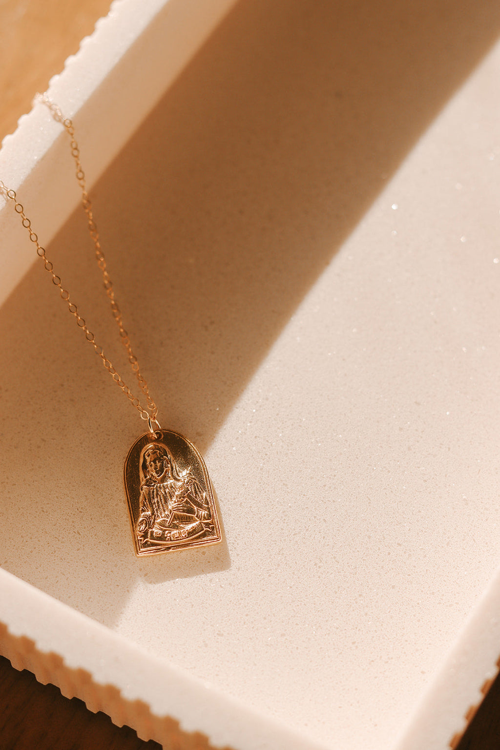 Gold St. Catherine of Sweden pendant necklace with detailed seated saint heart pendant