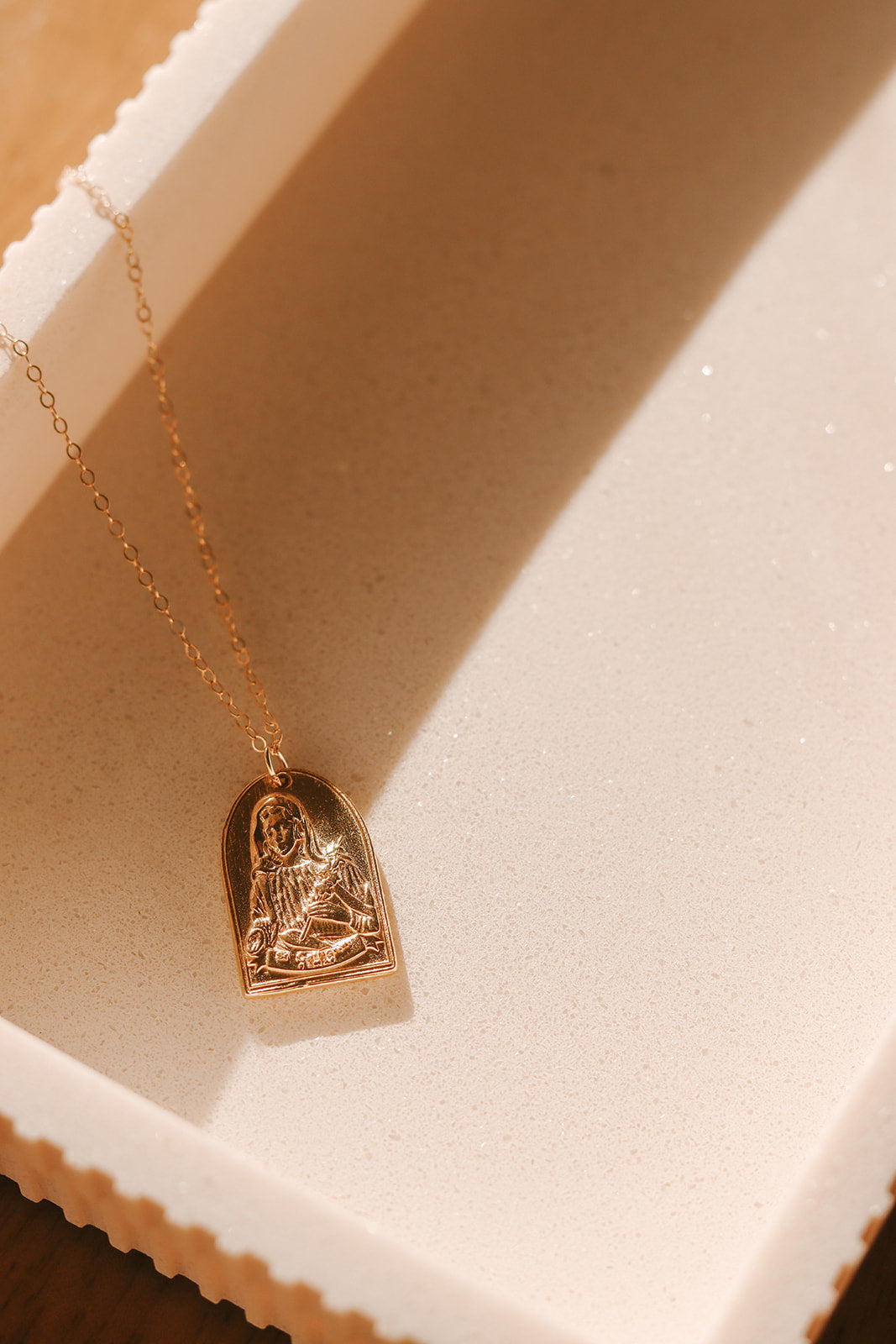 Gold St. Catherine of Sweden pendant necklace with detailed seated saint heart pendant