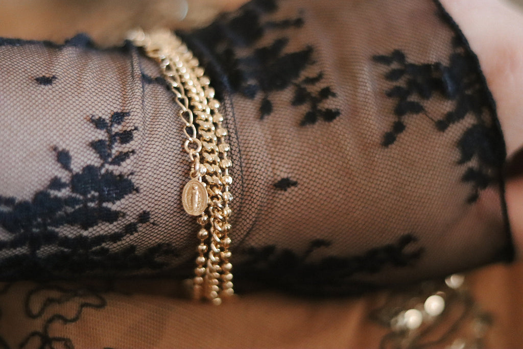 Gold-tone beaded and link bracelet with oval medal charm