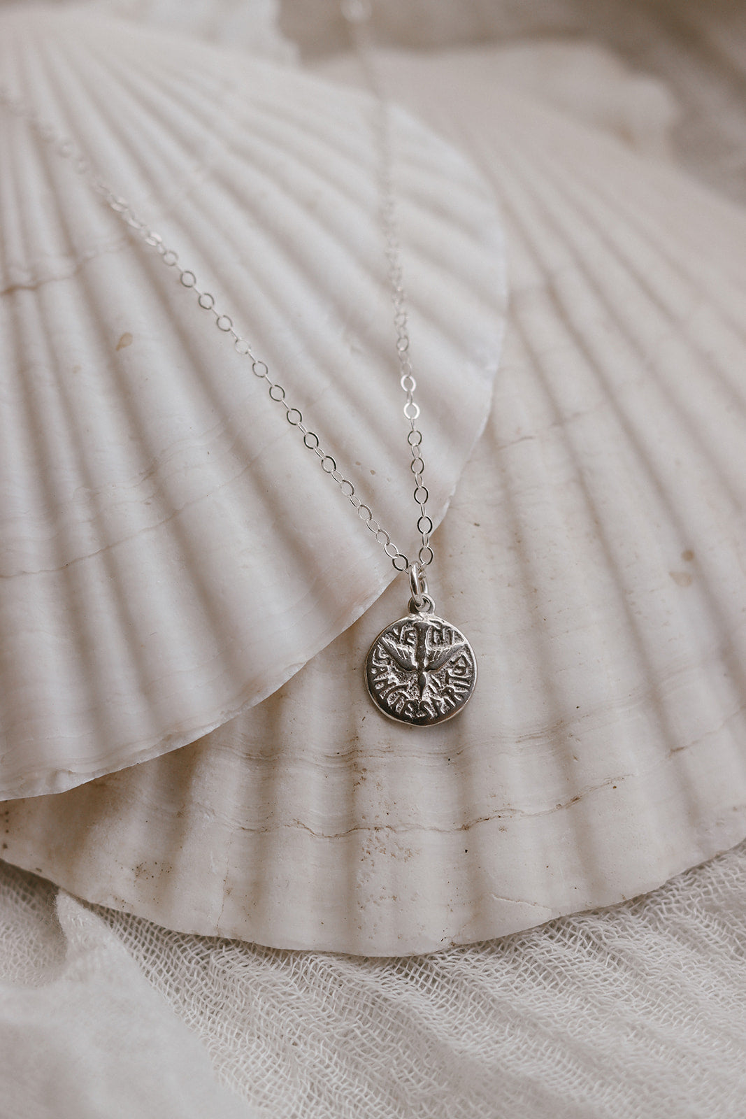Sterling silver necklace with round pendant and fine chain