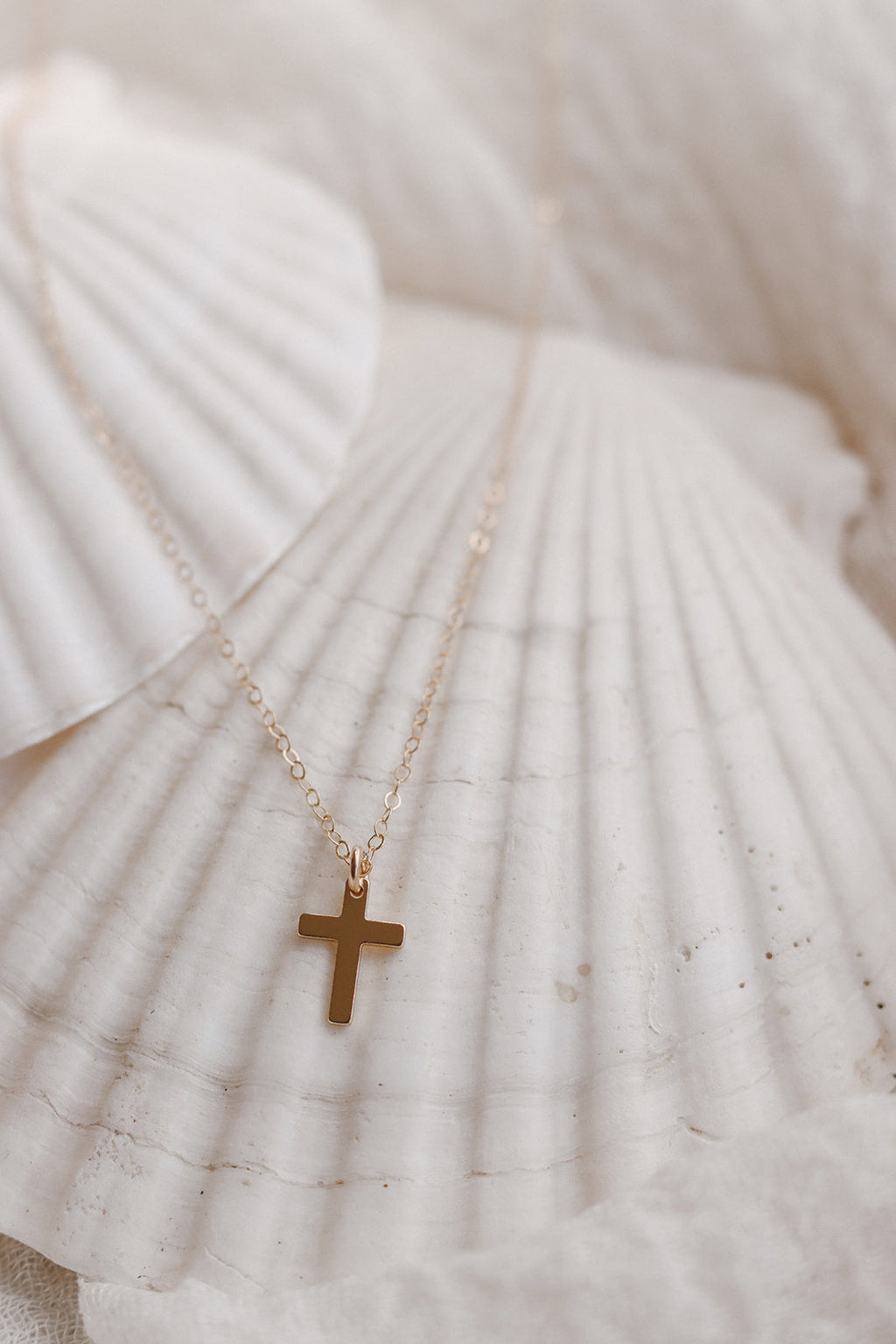 Gold cross pendant necklace with thin chain