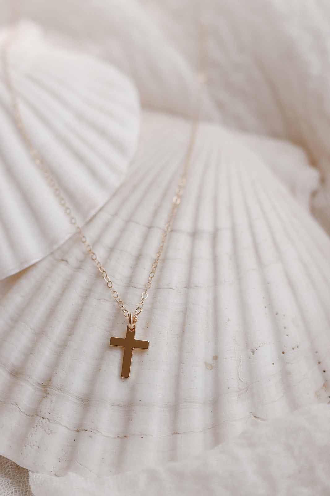 Gold cross pendant necklace with thin chain