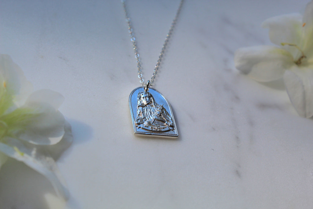 Sterling silver necklace with blue enamel heart saint pendant on a chain