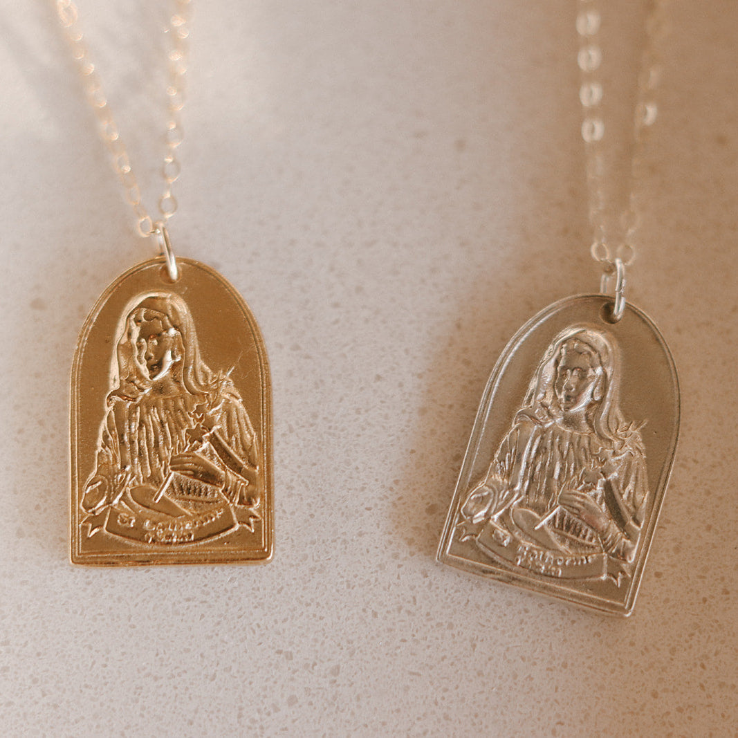 Pair of St. Catherine of Sweden pendant necklaces with engraved saint heart pendants