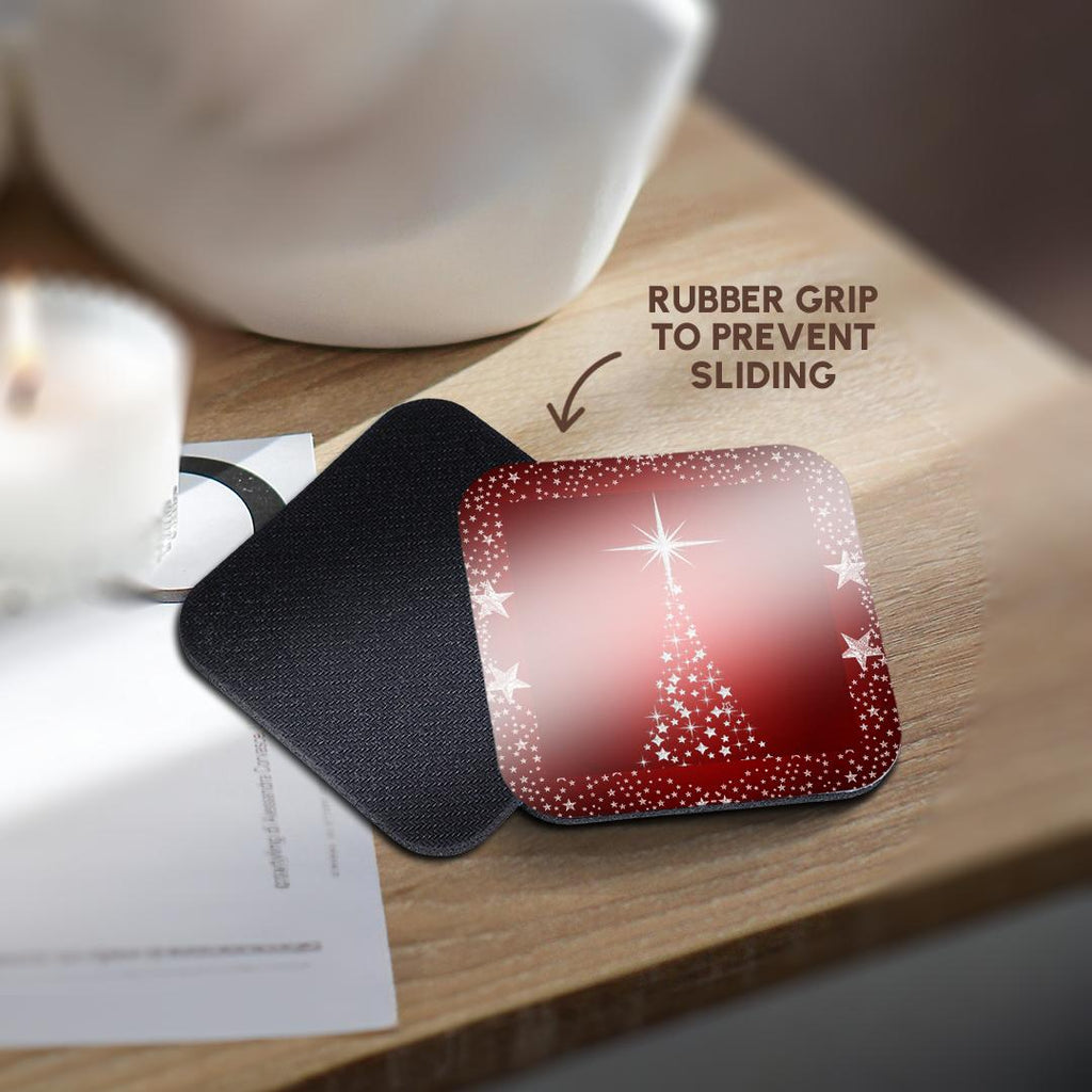 Red holiday star tree coaster with silver sparkle stars, resting on a dark textured backing