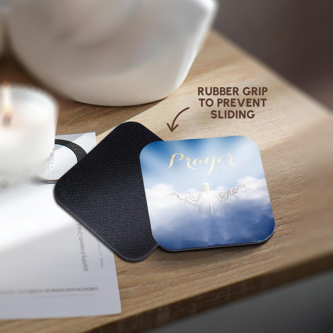 Blue prayer coaster with black textured backing; Jesus figure and 'Prayer' artwork