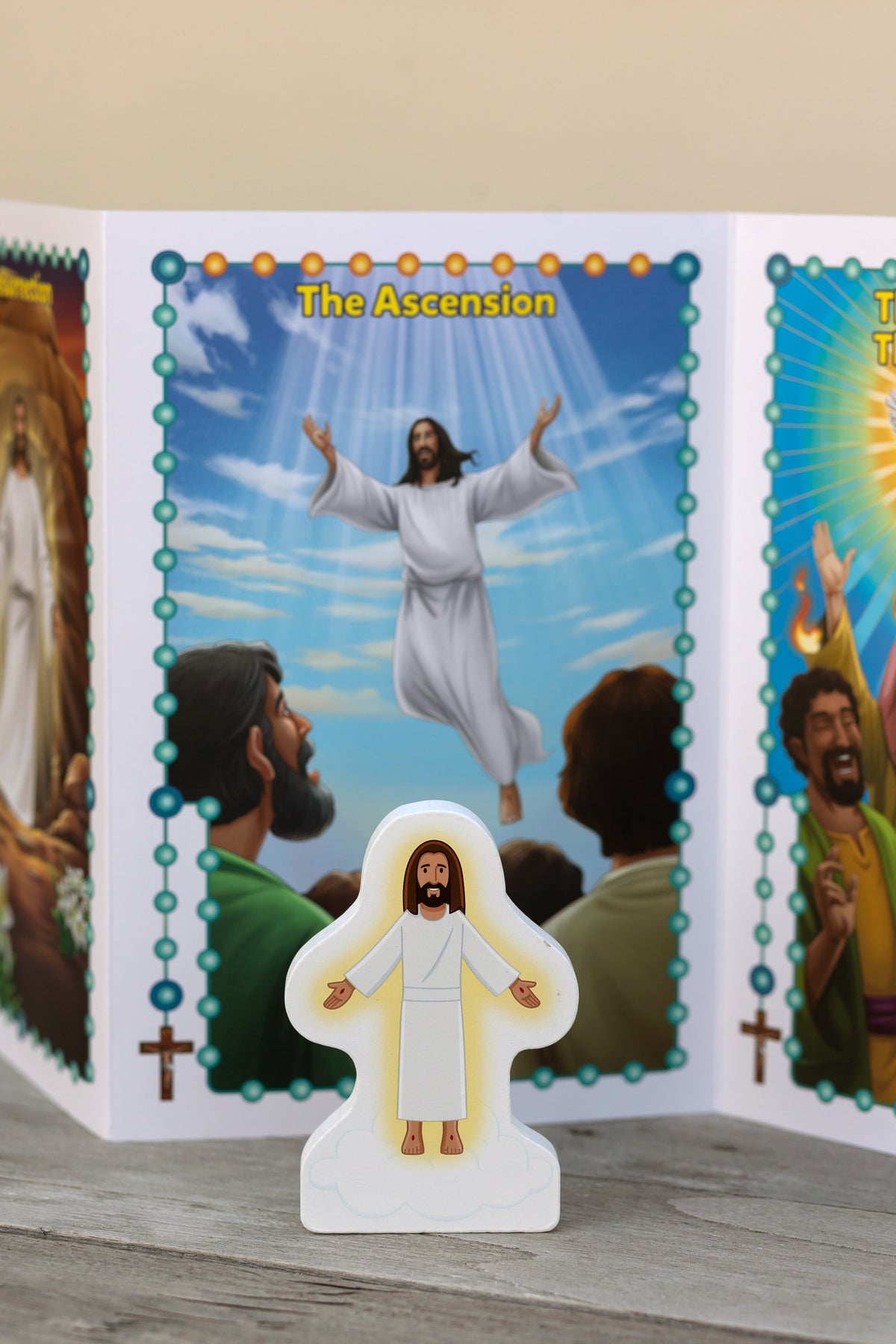 Rosary play set card panels featuring the Ascension scene with a standing Jesus figurine