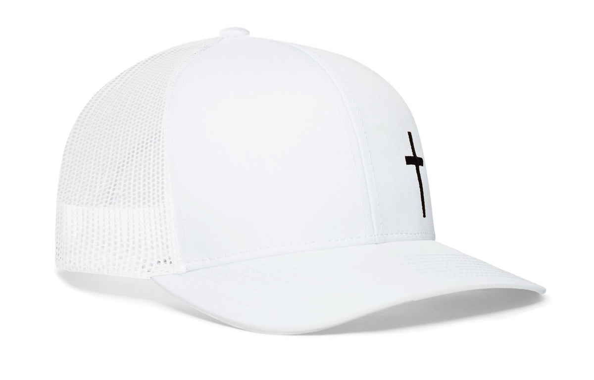 White trucker snapback cap with black cross embroidery on front, mesh sides, snapback.