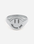Silver band ring with 'Choose Joy' engraving on the round face.