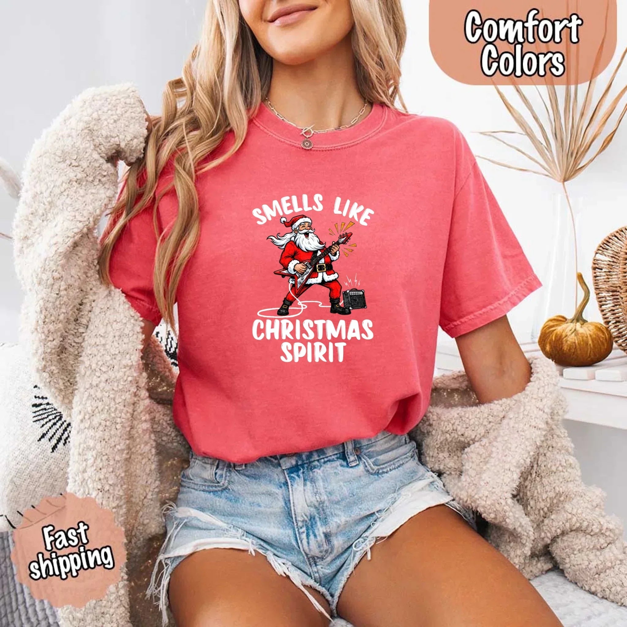 Coral pink T-shirt with Santa graphic and 'Smells Like Christmas Spirit' print